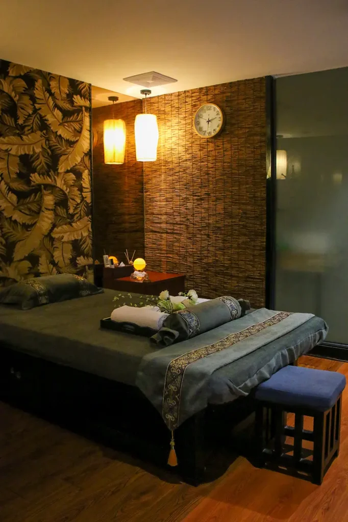 Professional therapist giving hotel in-room massage in Guangzhou luxury hotel